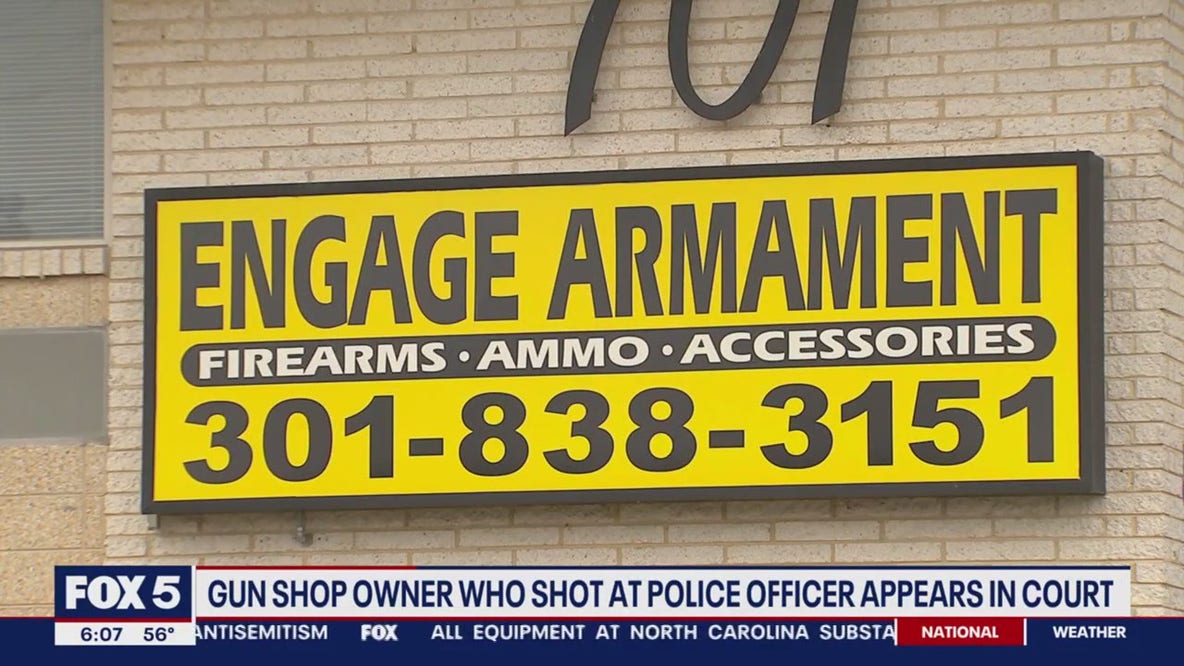 Gun shop owner who shot at police officer appears in court
